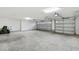 Spacious three car garage with high ceilings at 5868 Wood Stork Way, The Villages, FL 32163