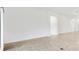 Bright, neutral living room with tile floors and arched doorways at 5868 Wood Stork Way, The Villages, FL 32163