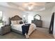 Tastefully decorated primary bedroom featuring tray ceiling, plush carpet, and sophisticated furnishings at 6301 Danielson Loop, The Villages, FL 32163