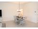 Elegant dining area with stylish lighting fixture and plenty of space at 6301 Danielson Loop, The Villages, FL 32163