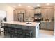 Bright kitchen featuring stainless steel appliances and light gray cabinets at 6301 Danielson Loop, The Villages, FL 32163