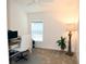 Cozy office with large window and simple decor at 6301 Danielson Loop, The Villages, FL 32163