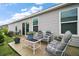 Relaxing back patio with comfortable seating and peaceful view of the backyard, perfect for relaxation at 6342 Whittle Ct, The Villages, FL 32163