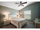 Bedroom with ceiling fan, window, and bedside tables with lamps at 6342 Whittle Ct, The Villages, FL 32163
