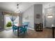 Bright dining area with modern lighting and a sliding glass door leading to the outdoors at 6342 Whittle Ct, The Villages, FL 32163
