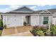 Charming single-story home with two-car garage and manicured landscaping enhancing the curb appeal at 6342 Whittle Ct, The Villages, FL 32163
