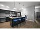 Bright kitchen showcases an island with seating and stainless steel appliances at 6342 Whittle Ct, The Villages, FL 32163