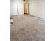 Bedroom with neutral carpeting, closet, and light walls at 679 Avenue Q Se, Winter Haven, FL 33880
