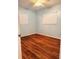 Bedroom with laminate flooring and natural light offers a comfortable retreat for rest and relaxation at 679 Avenue Q Se, Winter Haven, FL 33880