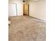 Spacious bedroom with carpet flooring, a closet, and an open doorway leading to another room at 679 Avenue Q Se, Winter Haven, FL 33880