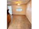 Dining area features tile flooring, bright natural light from a window and is next to wooden cabinet space at 679 Avenue Q Se, Winter Haven, FL 33880