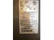 Close-up of the HVAC unit label, showing the model number, manufacturing date, and electrical specifications at 679 Avenue Q Se, Winter Haven, FL 33880