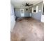 Covered outdoor patio features a ceiling fan, neutral paint, and offers a comfortable space for relaxation and outdoor living at 679 Avenue Q Se, Winter Haven, FL 33880