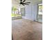 Enclosed sunroom featuring a large space with a lattice privacy screen on the windows and screens around the room at 679 Avenue Q Se, Winter Haven, FL 33880