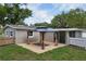 Backyard patio area with a gazebo and a partial view of the house at 780 N Kentucky Ave, Umatilla, FL 32784