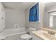 Bathroom features a soaking tub and pedestal sink at 780 N Kentucky Ave, Umatilla, FL 32784