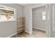 Bedroom with luxury vinyl plank flooring and open closet space, providing extra storage at 780 N Kentucky Ave, Umatilla, FL 32784