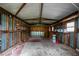 Interior of the shed featuring exposed framing, concrete flooring and walls at 780 N Kentucky Ave, Umatilla, FL 32784