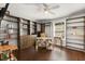 Spacious bedroom with built in shelves and storage, ceiling fan, and a large window allowing for natural light at 800 Daybreak Dr, Fruitland Park, FL 34731