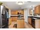 Kitchen featuring an island, wood cabinets, and stainless steel appliances at 800 Daybreak Dr, Fruitland Park, FL 34731