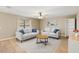 Bright living room with two couches, a ceiling fan, and tile floors at 800 Daybreak Dr, Fruitland Park, FL 34731