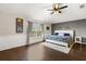 Main bedroom with hard wood floors and a neutral color palette at 800 Daybreak Dr, Fruitland Park, FL 34731