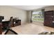 Bright home office featuring tile floors, large window with neighborhood views, and built in shelves at 800 Daybreak Dr, Fruitland Park, FL 34731