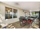 Covered patio area showcasing a dining table with chairs at 800 Daybreak Dr, Fruitland Park, FL 34731