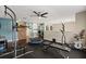 Functional workout room with an exercise bike, bench, and trampoline, enhanced with a barn door entrance at 800 Daybreak Dr, Fruitland Park, FL 34731