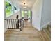 Entryway features stairs, modern lighting and an abundance of natural light at 8203 Bluestar Cir, Orlando, FL 32819