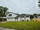 Charming two-story home with a large lawn and a welcoming exterior at 8203 Bluestar Cir, Orlando, FL 32819