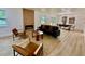 Spacious open-concept living area with modern fireplace and dining space at 8203 Bluestar Cir, Orlando, FL 32819