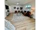 Modern living room featuring stylish furniture, wood floors, and contemporary decor at 8203 Bluestar Cir, Orlando, FL 32819