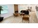 Open-concept living room with fireplace, modern furnishings, and ample natural light at 8203 Bluestar Cir, Orlando, FL 32819
