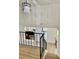 Staircase leads to living area, features modern chandelier lighting at 8203 Bluestar Cir, Orlando, FL 32819
