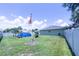 Expansive, well-maintained backyard with an above-ground pool and mature landscaping at 8489 Se 158Th Pl, Summerfield, FL 34491