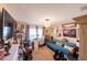 Cozy bedroom with a daybed, desk, decorations, fan, and a window with blinds at 8489 Se 158Th Pl, Summerfield, FL 34491
