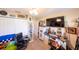 Guest bedroom with display cases, closet, vintage decor, and natural light at 8489 Se 158Th Pl, Summerfield, FL 34491