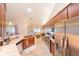 Bright and open kitchen featuring modern appliances, granite countertops, and wood cabinetry at 8489 Se 158Th Pl, Summerfield, FL 34491