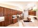 Kitchen with light countertops, dark cabinetry, stainless steel appliances, tiled floor, and recessed lighting at 8489 Se 158Th Pl, Summerfield, FL 34491