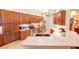 Updated kitchen with custom cabinets, stainless steel appliances, and stone countertops at 8489 Se 158Th Pl, Summerfield, FL 34491