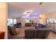 The spacious living room is complete with comfortable seating and a large TV at 8489 Se 158Th Pl, Summerfield, FL 34491