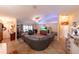 Open living room with tile floors, large sofa and plenty of natural light at 8489 Se 158Th Pl, Summerfield, FL 34491