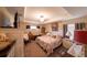 Comfortable bedroom featuring cozy furnishings, soft lighting, and a relaxing ambiance at 8489 Se 158Th Pl, Summerfield, FL 34491