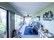 Relaxing screened in patio with comfortable seating and decor at 8489 Se 158Th Pl, Summerfield, FL 34491