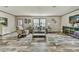 Bright living room featuring modern flooring, neutral walls, and comfortable furniture at 892 Se 124Th Ave, Webster, FL 33597