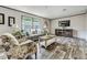 Bright and airy living room with plush seating, modern decor, and large windows at 892 Se 124Th Ave, Webster, FL 33597