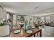 Spacious open-concept living space with modern flooring, updated appliances, and cozy furnishings at 892 Se 124Th Ave, Webster, FL 33597