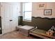 ' bedroom featuring road-themed wall art, cozy bed, and double door access for easy access at 9219 Chandler Dr, Groveland, FL 34736