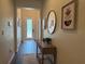 Welcoming foyer with decor, wood-look tile and furniture at 9219 Chandler Dr, Groveland, FL 34736